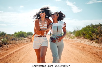 Walking, happy and friends on holiday at a safari during summer together in nature of Kenya. Happy, playful and young African women on vacation in the desert for travel, freedom and adventure