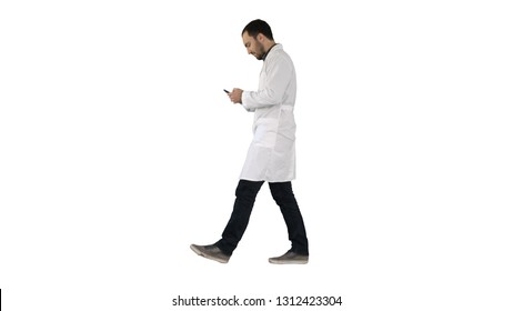 Walking medical professional using smart phone and making attantion gesture on white background. - Powered by Shutterstock