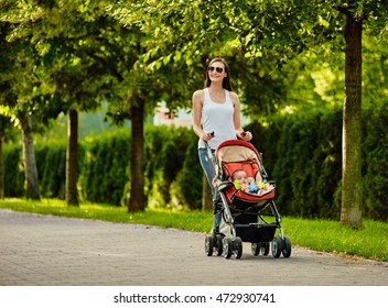 walking Mother with baby carriage