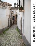 Walking in old central part of world heritage city Granada, Andalusia, Spain in spring