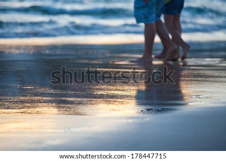 walking on the beach at sunset