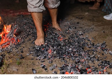 Walking on the burning cinders close-up side view. - Powered by Shutterstock