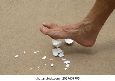 Walking On Egg Shells Idiom Showing Mans Shoeless Naked Foot About To Step On Egg Shells