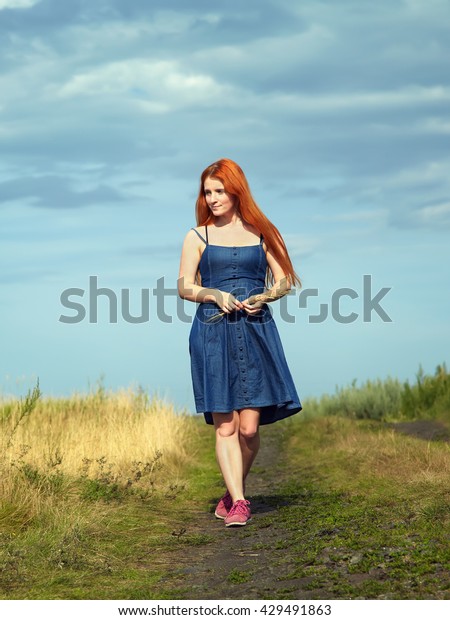 redhead at the side of the road