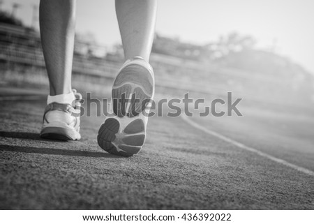Walking on a running track. 