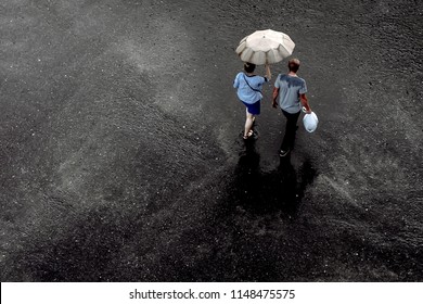 Walking on wet asphalt