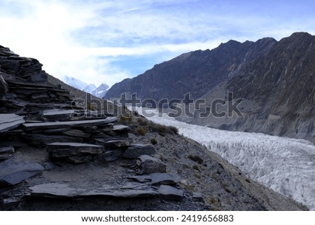 A walking path along the large ice field at Passu Glacier on the Karakoram Highway in the northern part of Gilgit-Baltistan.