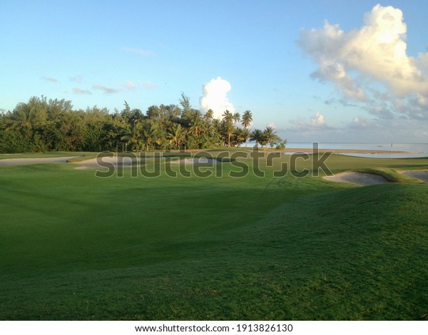 Walking path through a Golf Club in Coco Beach,\
Puerto Rico during\
sunrise