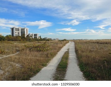 Walking path under a cloudy sky