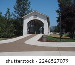 Walking Paths through the open-sided Weddle Covered Bridge that originally spanned Thomas Creek and has been relocated to cross Ames Creek Sankey Park in Sweet Home, Oregon.