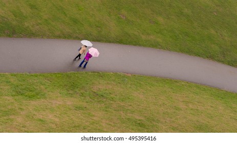 Walking In The Rain With Umberella