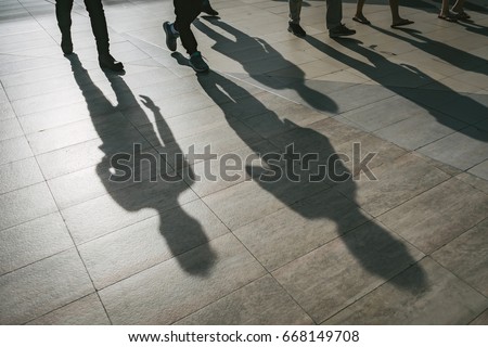 Walking shadow business team.