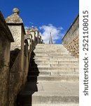 Walking up a staircase In the castle that inspired the castle in Disney