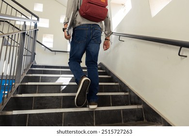 Walking up stairs, asian teenage boy with red backpack heading to class in school. Education, back to school, learning, teenager, staircase, academic - Powered by Shutterstock