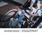 Walking, stairs and group of business people outside office for discussion, planning and travel together. Men, women and professional friends on steps with chat, drink and morning commute from above