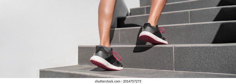 Walking up the stairs leg workout. Hiit training running up staircase. Fitness woman going up steps panorama banner. Runner athlete sport shoes closeup.