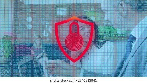 Walking team wearing suits, carrying tablet in office hall, showing red shield icon over code grid. Corporate, teamwork, cybersecurity, data protection, modern, professional, technology