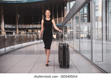 Walking Through The Airport. A Confident Woman Getting Ready For A Business Trip