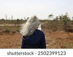 Walking through a bog in spring
