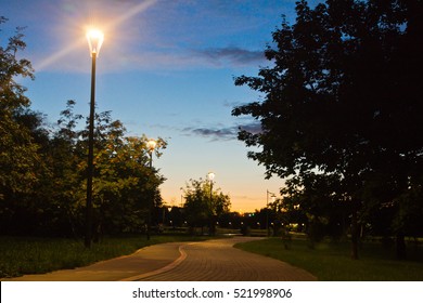 walking trail in the evening summer park