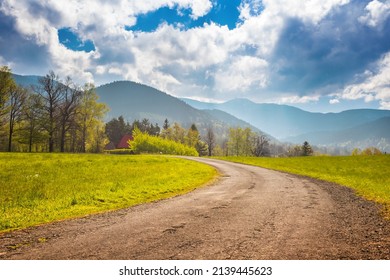 Walking trail in a small village as marvelous moutain view with blue sky, Malenovice, Moravian-Silesian Beskydy. Czech Republic. - Shutterstock ID 2139445623