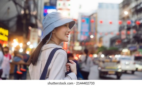 Walking Young Adult Asian Woman Traveller Backpack. People Traveling In City Lifestyle Chinatown Street Food Market Bangkok, Thailand. Staycation Summer Trip Concept. Bokeh On Background.