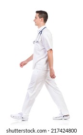 Walking Young Male Nurse, Side View. Full Length Studio Shot Isolated On White.