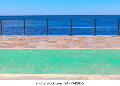 Walkway with balustrade on the sea, background of the sea and the blue sky - Powered by Shutterstock