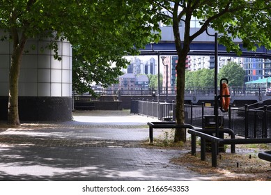 A Walkway By The Side Of South Quay Looking Towards South Quay DLR Station And Millwall Dock, E14, London.