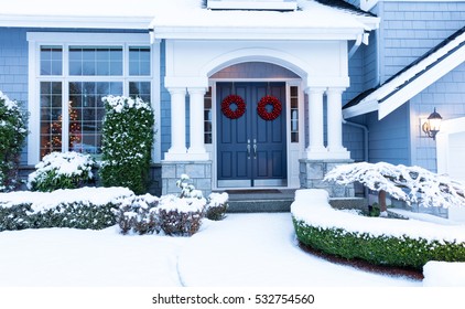 Walkway To A Fresh Blanket Of Snow On Residential Home During The Winter Holidays.