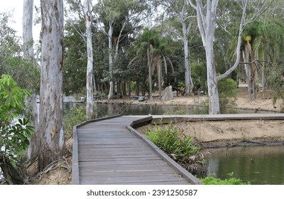 Walkway path through trees at Reg Tanna Park in Gladstone, Queensland, Australia