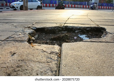 The walkway surface is damaged and bumpy.  May cause danger to people roaming.