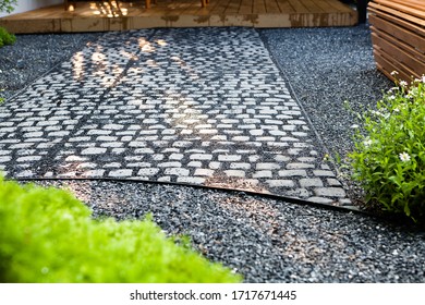 Walkways Cobble Stone In Garden With Shadow Lightning And Green Leaf 