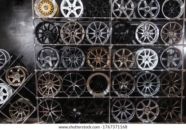 wall of alloy wheels in the store. Auto\
repair shop background. Auto Wheel\
Service\
