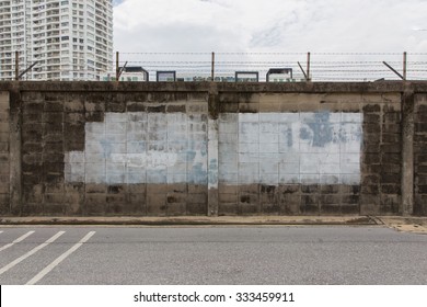 Wall With Barbed Wire Fence