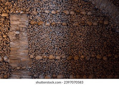 Wall of bones and human skulls from The Chapel of Bones located in the city of Évora in Portugal.
It is located in the Church of San Francisco. It was built by initiative of three Franciscan monks.