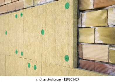 Wall Of Bricks And Insulation Wool