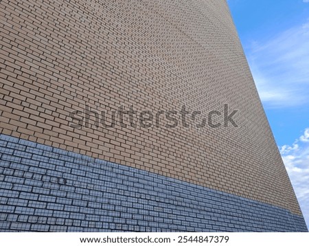 a wall of bricks, a piece of sky