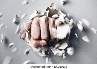 a wall is broken through by a fist