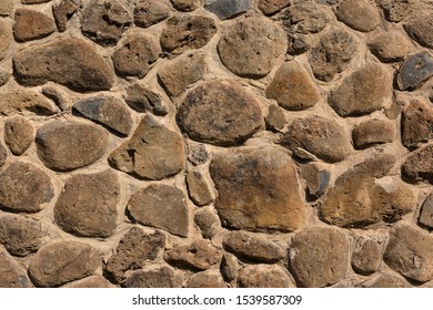 Wall Built Of Large And Small Basalt Stone