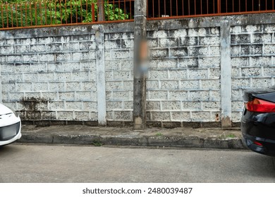 A wall with a car parked in front of it - Powered by Shutterstock