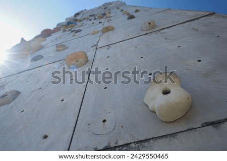 wall climbing or rock climbing. a climbing sport that uses artificial rocks