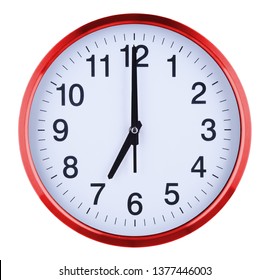 Wall clock isolated on white background. Seven oclock.