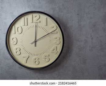 Wall Clock On A Gray Background. Clock Close-up. Watch Face With Large Numbers.