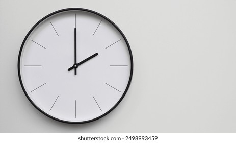 Wall Clock Showing 14.00 or 2.00 O'Clock on White Wooden Surface - Perfect for Time Management and Scheduling Concepts