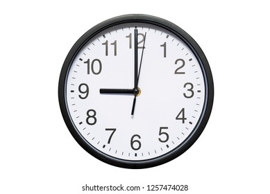 Wall clock shows time 9 o'clock on white isolated background. Round wall clock - front view. Twenty one o'clock - Powered by Shutterstock