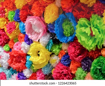 A Wall Of Colorful Mexican Paper Flowers