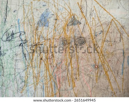  a wall covered in scribbles and drawings made by children