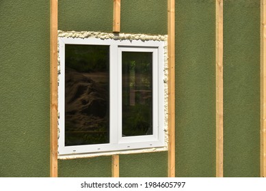 Wall Covering Of The Frame House With Panels Of Vinyl Siding. Construction Or Reconstruction, Repair Of The House. Installation Of Plastic Windows In A New Residential Building.