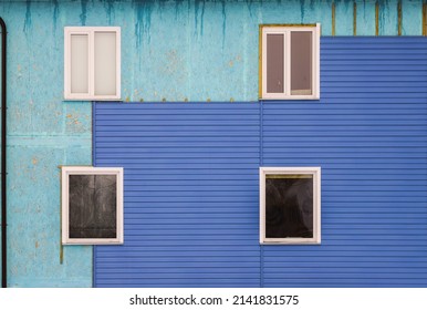 Wall Covering Of The Old House With Panels Of Vinyl Siding. Construction And Facade Reconstruction. Repair Of The House